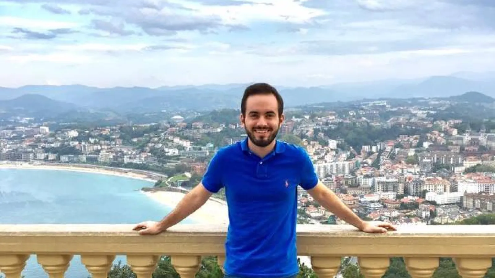 Anthony Palmiscno in front of a scenic coast