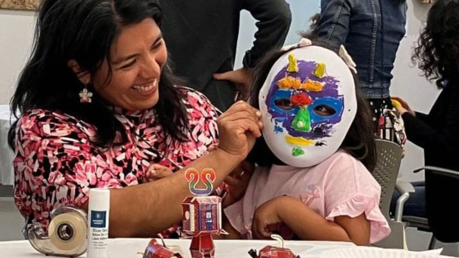 Trying on papier-mache mask