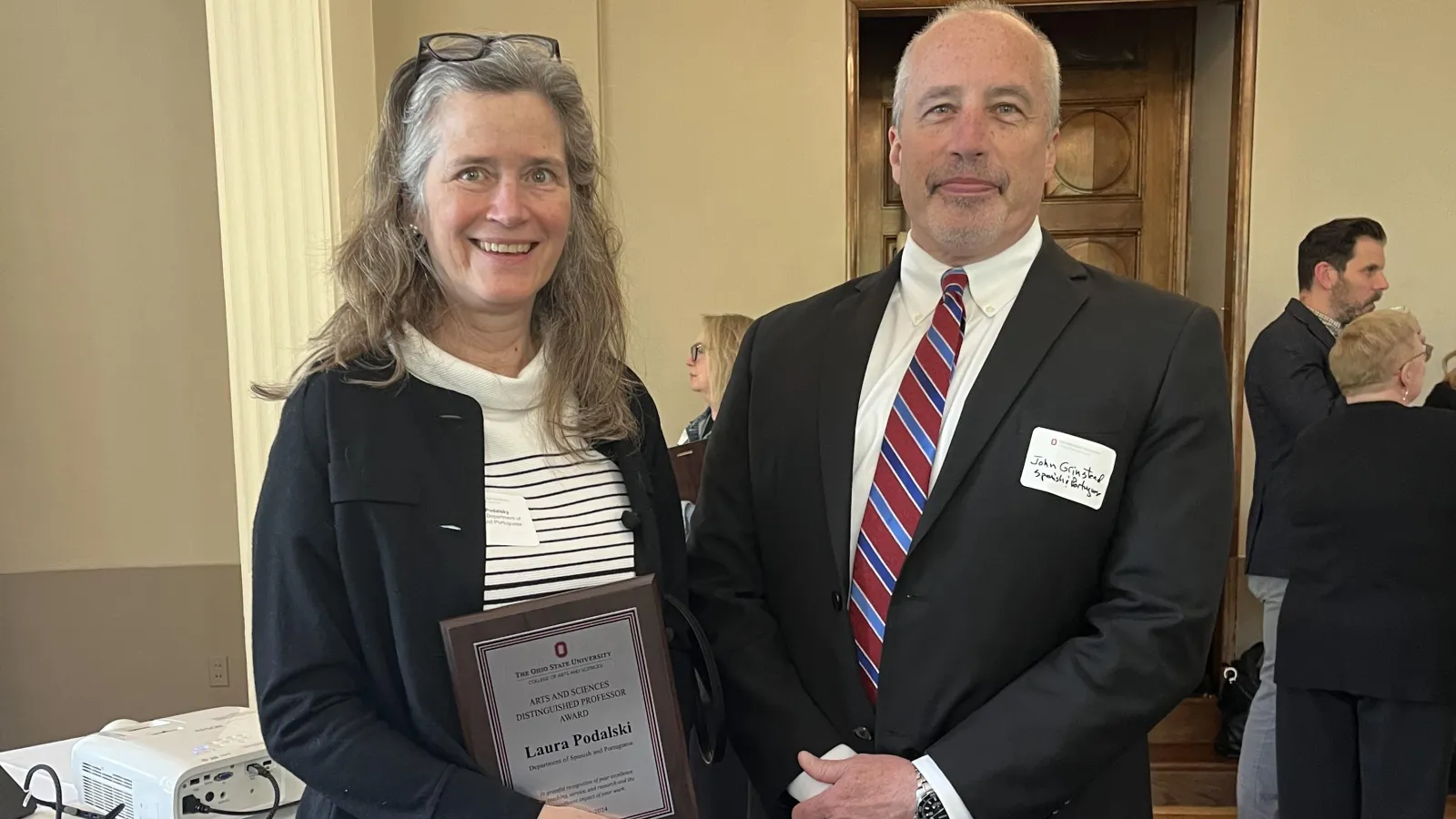 Laura Podalsky receiving award