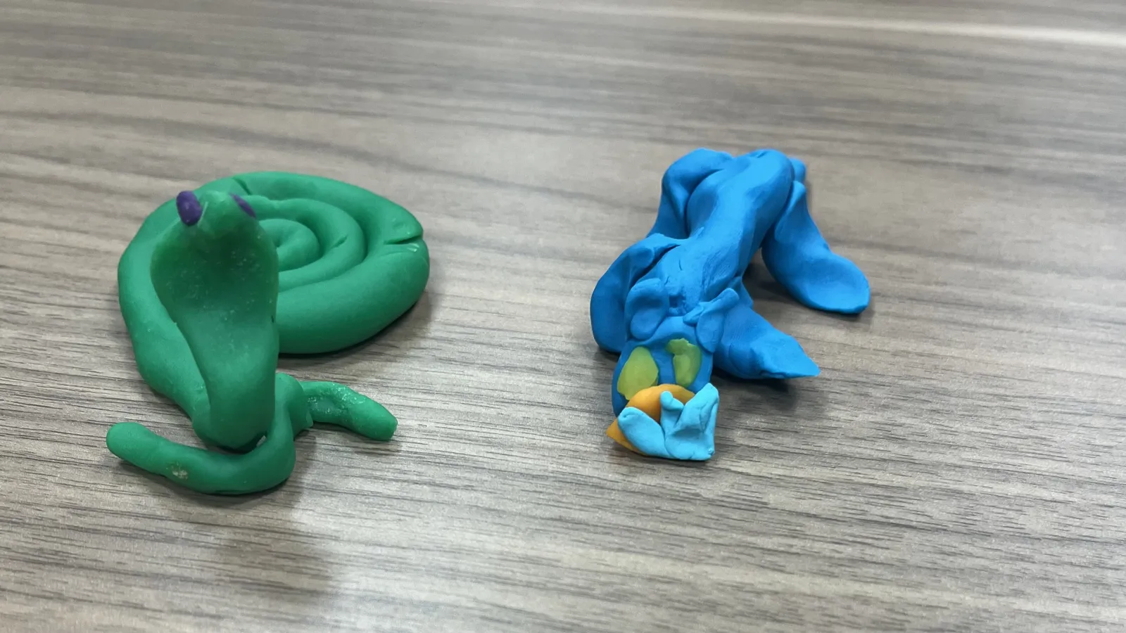 Student clay creation of two snakes 
