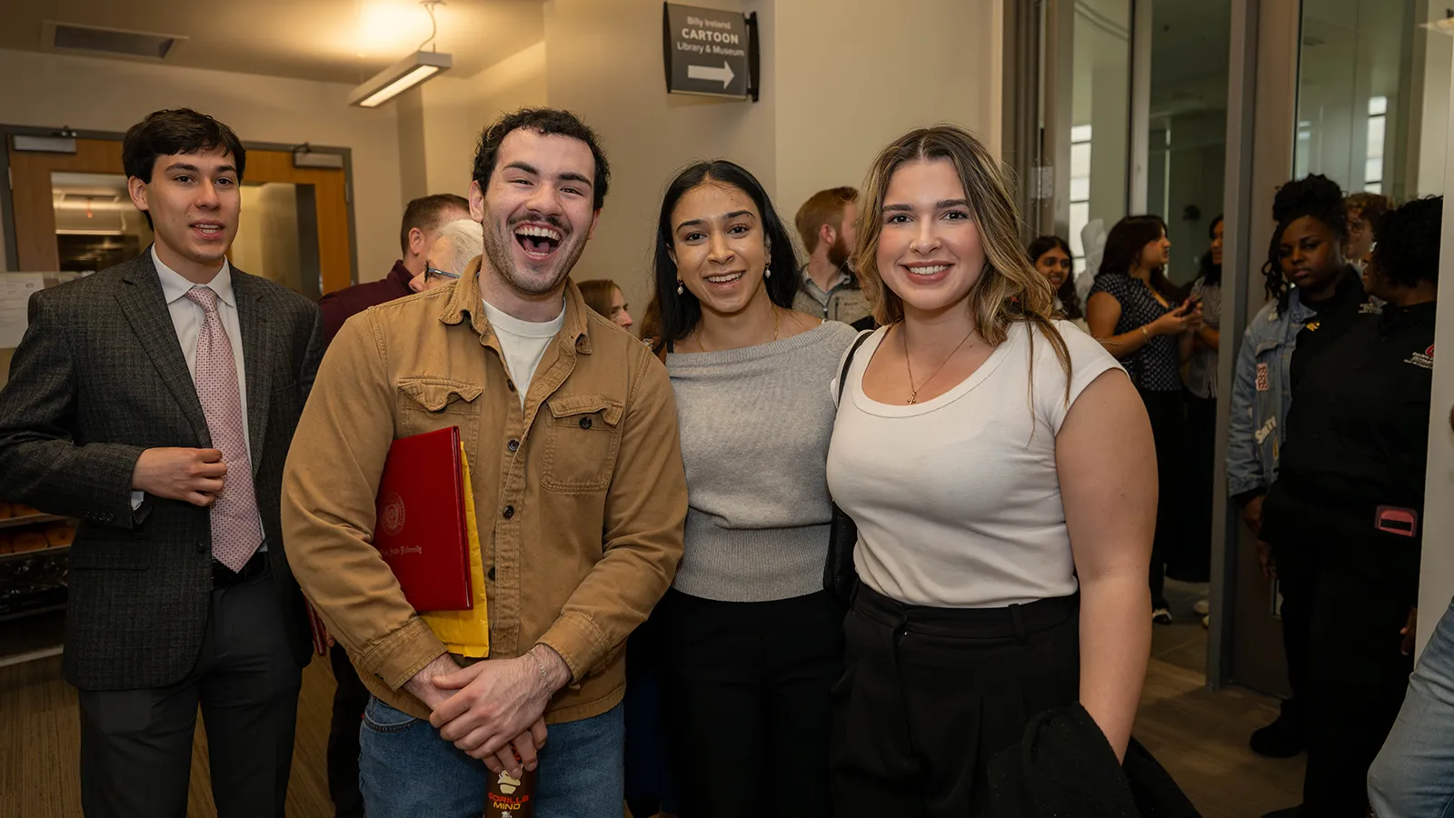 grads smiling together at reception