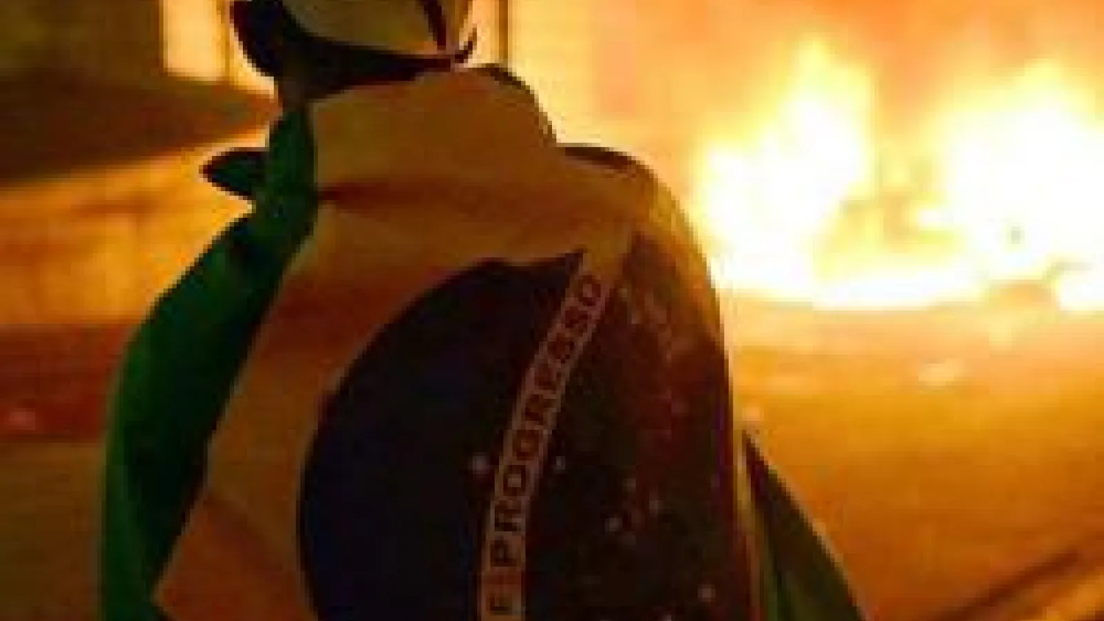 person looking at fire