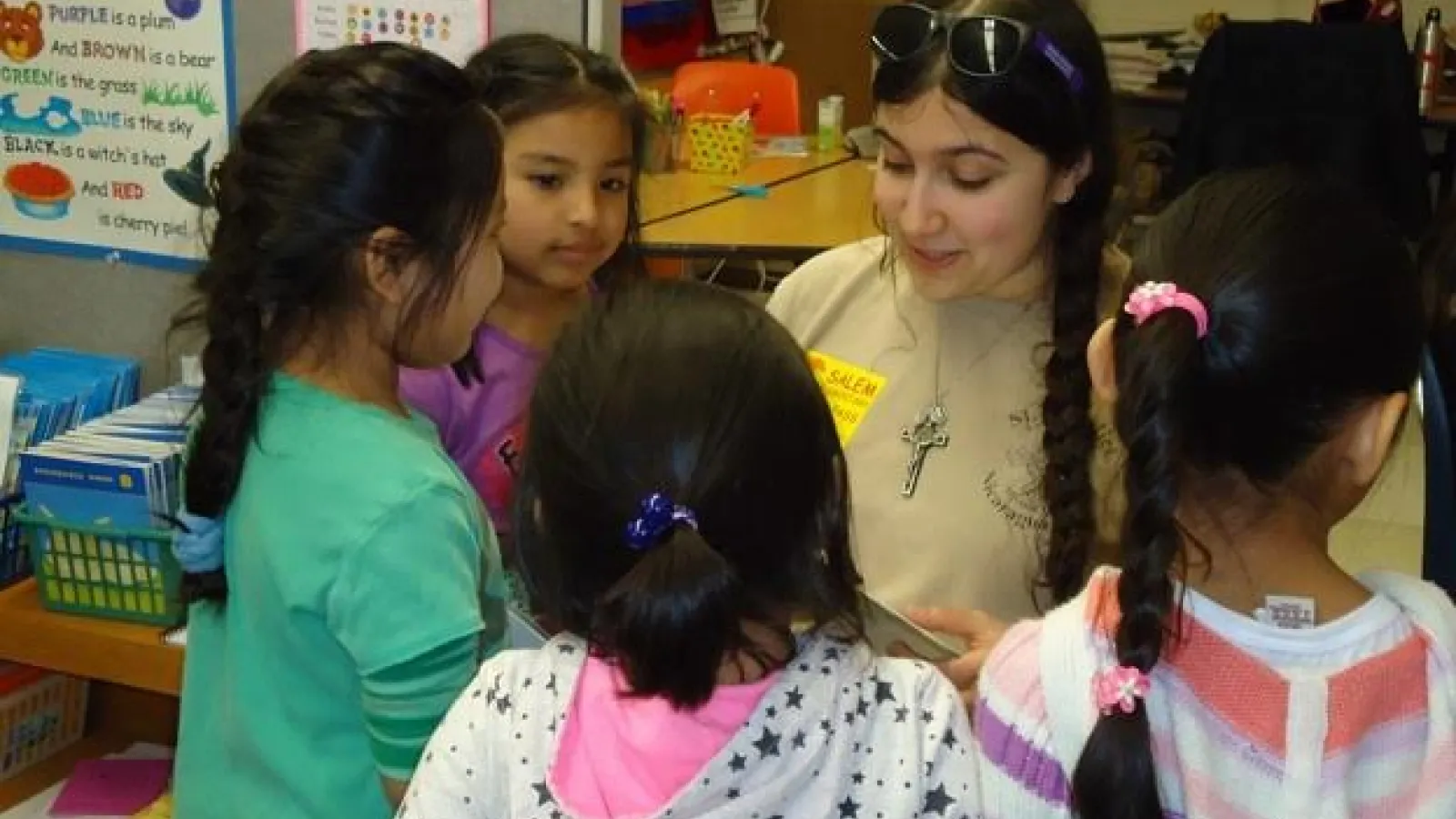 Ohio State Spanish student Rachel Cannata reads a story to a group of first-graders at Salem Elementary School. Courtesy: Jill Welch