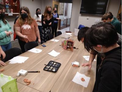 People creating retablo sculptures