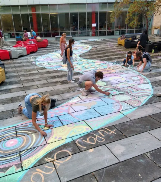Students drawing with chalk 