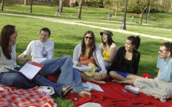 Students sitting on grass