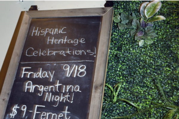 A chalkboard advertises Palmas Tropical Escape restaurant's celebration of Hispanic Heritage Month. Eric Albrecht/The Columbus Dispatch.