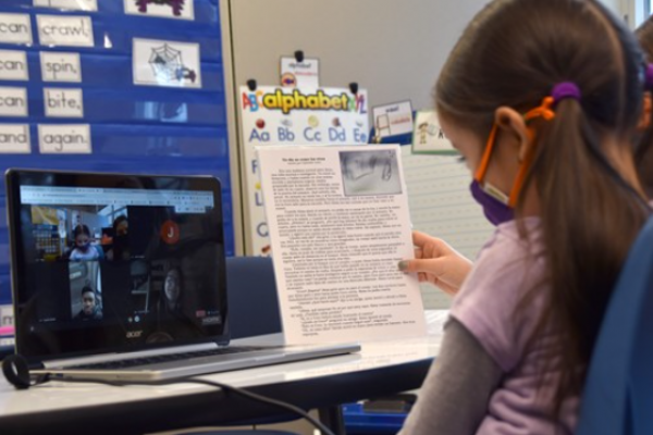 Longfellow elementary student reading bilingual storybook - photo courtesy of Westerville City School District website